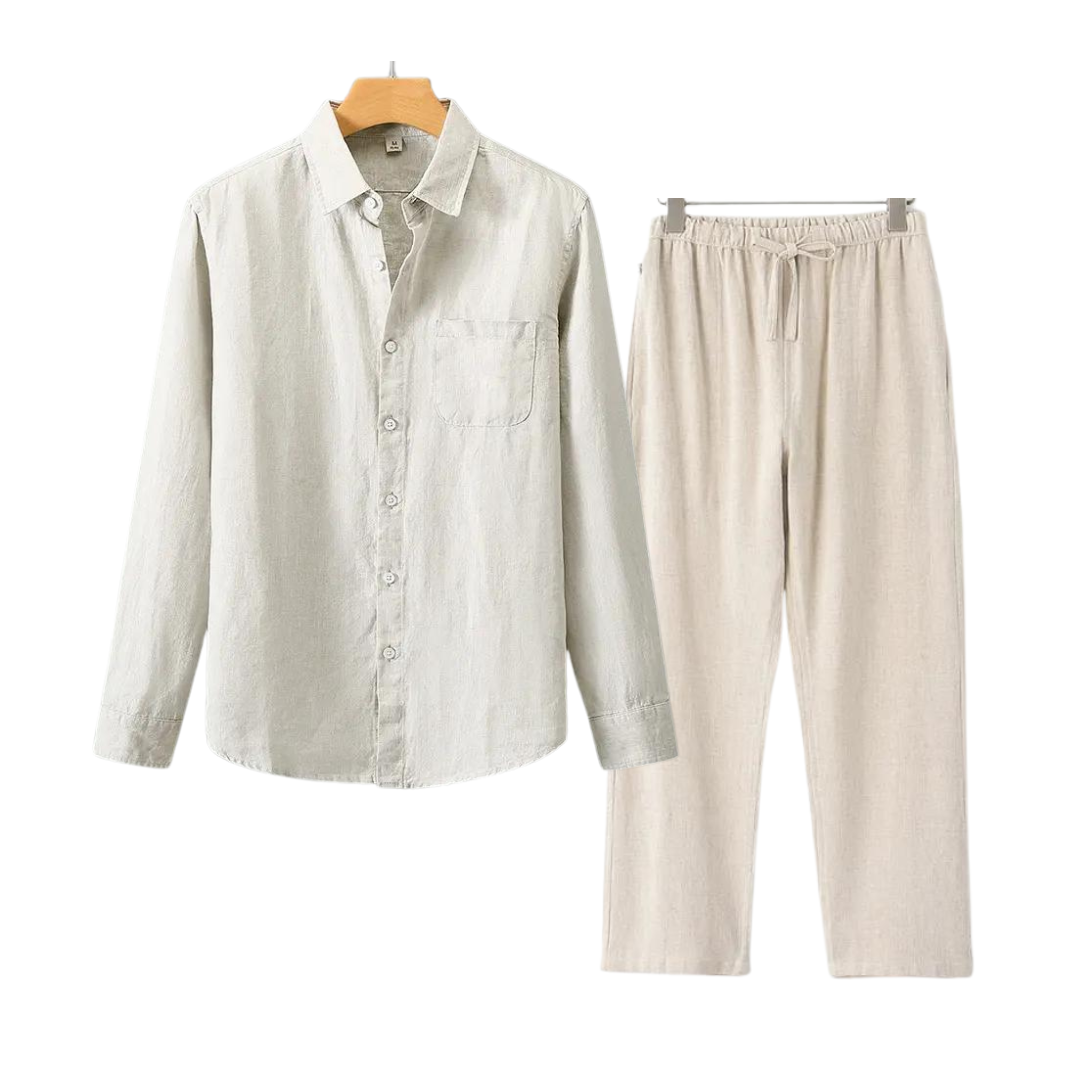 Light gray shirt and beige pants on hangers against a white background