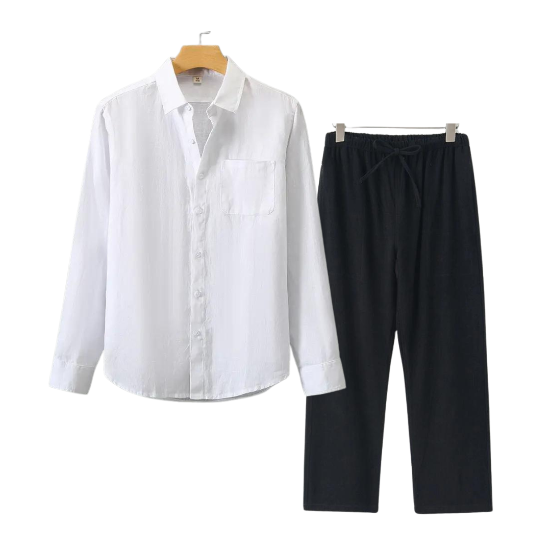 White shirt and black pants on hangers against a white background